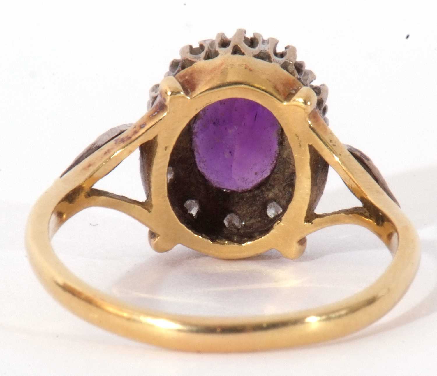 Amethyst and diamond cluster ring, the oval faceted amethyst raised within a small single cut - Image 5 of 9