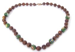 Single row of modern Chinese beads, a design featuring uniform brown mottled coloured beads