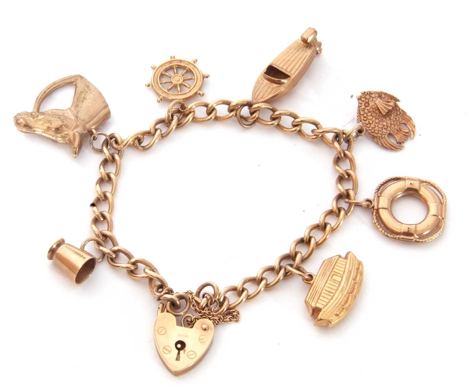 9ct gold curb link bracelet suspending seven various hallmarked charms to include a horse profile,