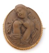 Victorian gold framed lava cameo in relief of a classical lady holding a floral sprig, 40 x 35mm