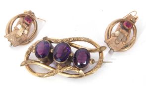Mixed Lot: Victorian large open work gilt metal brooch set with three large purple coloured