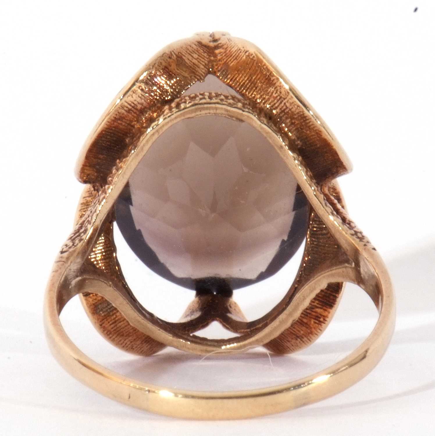9ct gold smoky quartz dress ring, the large oval faceted quartz cardinal set in a stylised mount, - Image 4 of 9