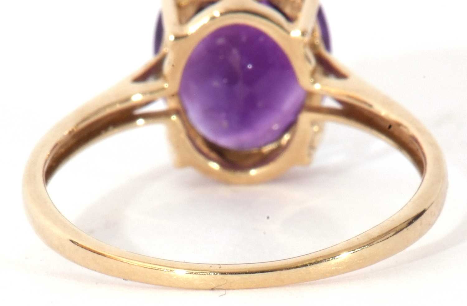 Modern 9ct gold amethyst and diamond ring, the oval faceted amethyst basket set and raised between - Image 6 of 9