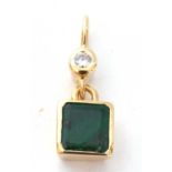 A high grade yellow metal emerald and diamond pendant, the flat square cut emerald framed and