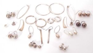 Fifteen pairs of various white metal earrings, together with three single earrings, 47gms g/w