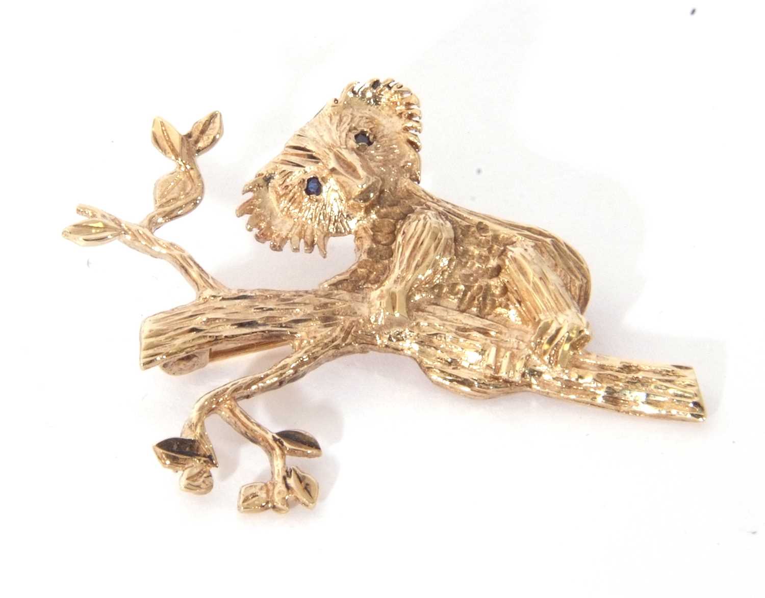 9ct gold Koala brooch, the Koala with two small dark blue sapphire eyes on a textured eucalyptus - Image 2 of 3