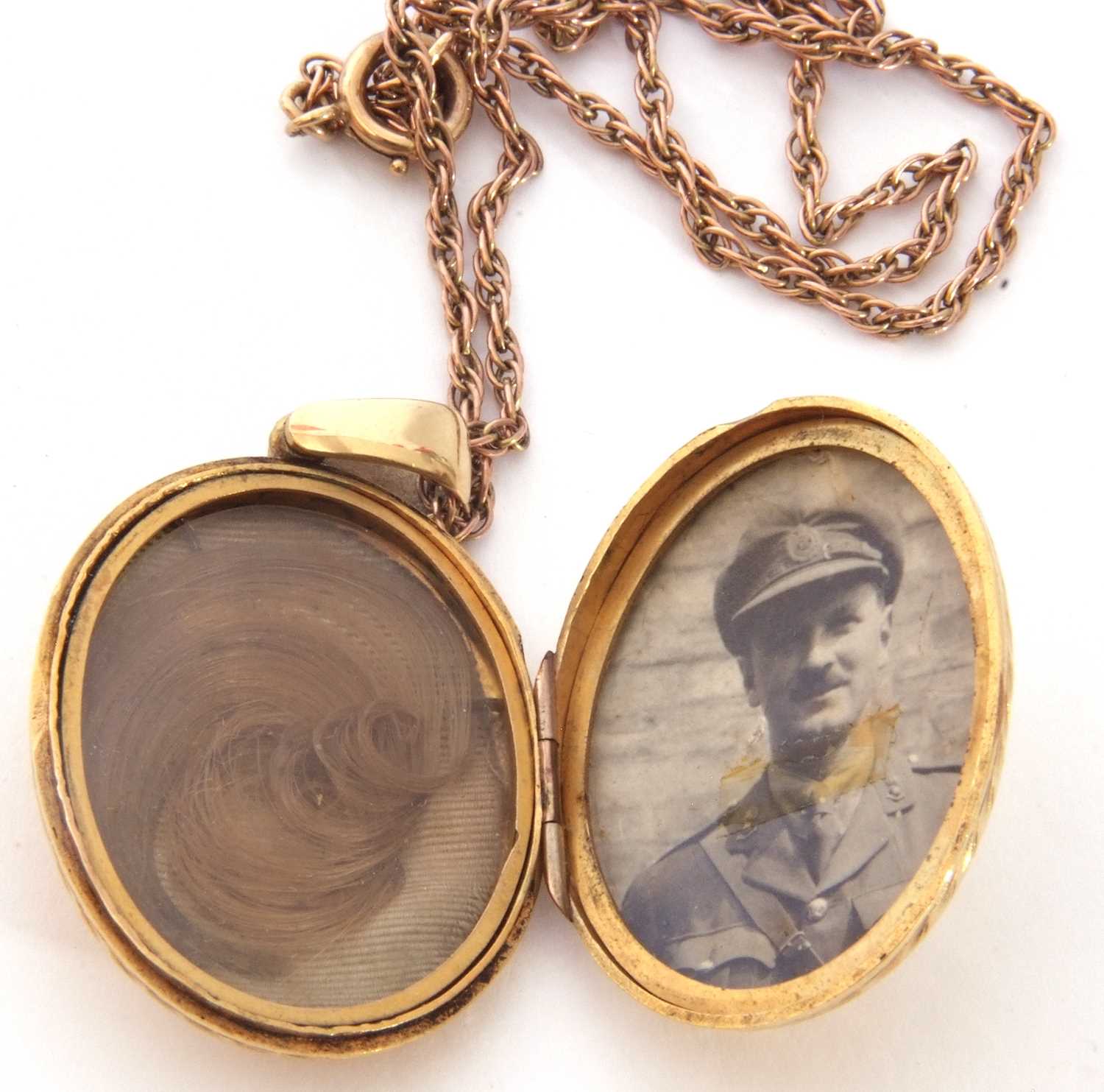 Gold back and fornt oval hinged locket engraved and chased both sides, 4 x 3cm, together with a - Image 3 of 3