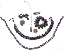 Mixed Lot: vintage jet bow tie brooch, a jet chain necklace, together with a bead example and