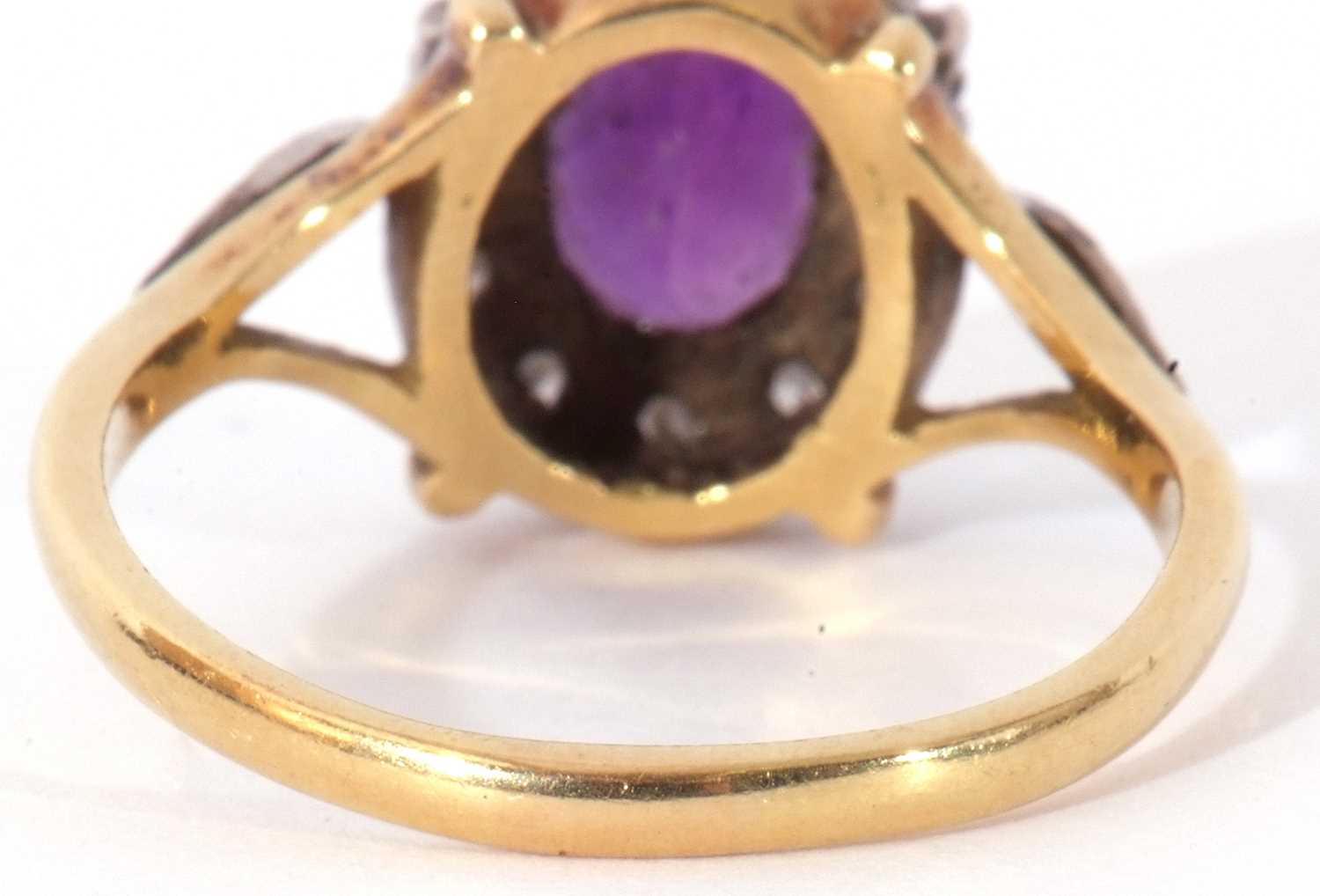 Amethyst and diamond cluster ring, the oval faceted amethyst raised within a small single cut - Image 6 of 9