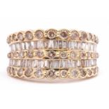 Modern 14K stamped diamond cluster ring, design featuring two bands of graduated baguette diamonds