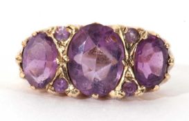 9ct gold three stone amethyst ring featuring three graduated oval facet cut amethysts highlighted