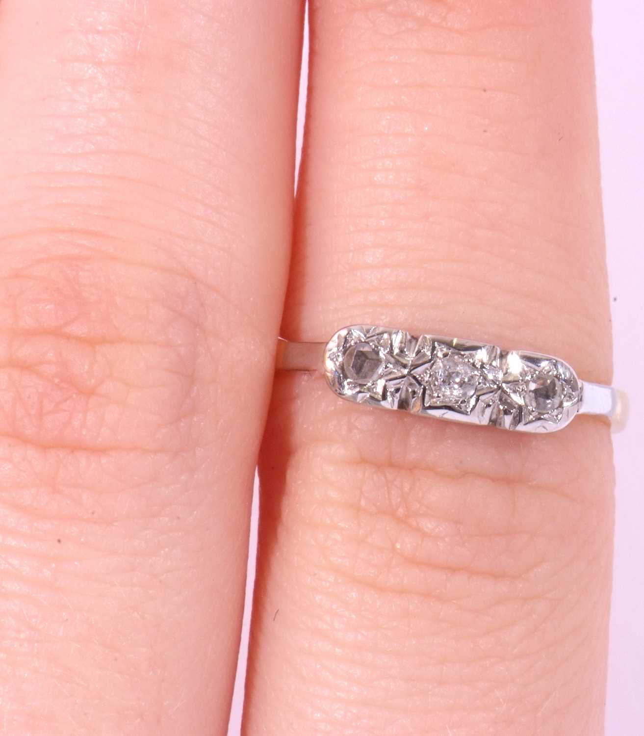 Three stone diamond ring, illusion set with three small mixed cut diamonds, stamped 18ct and Plat, - Image 10 of 10