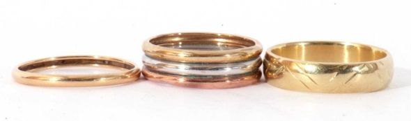 Mixed Lot: two yellow metal rings, together with a tri-colour ring, all unmarked, all test for 9ct