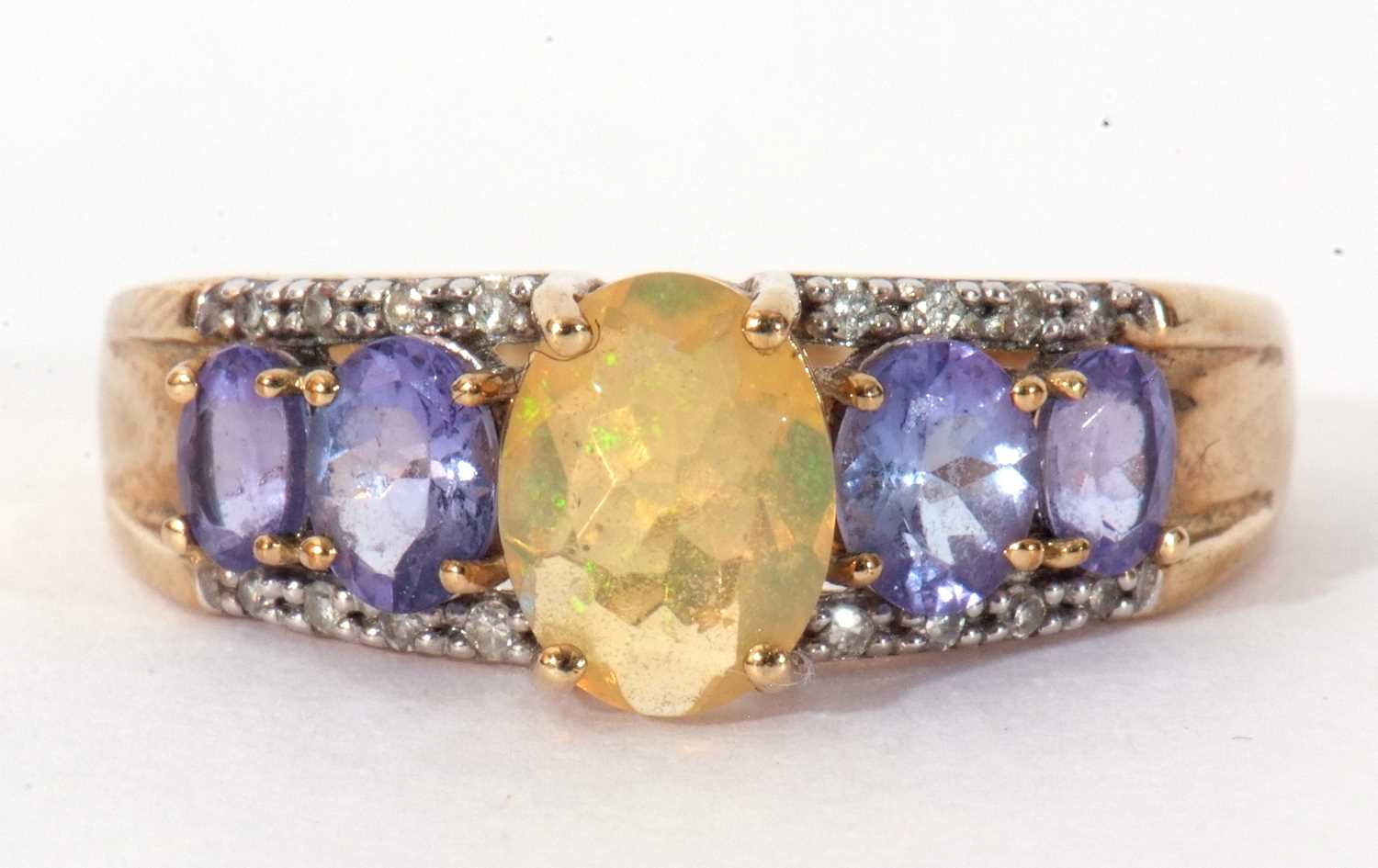 Modern 9ct gold, opal, tanzanite and diamond ring, the oval cut opal raised above a tanzanite and - Image 2 of 8