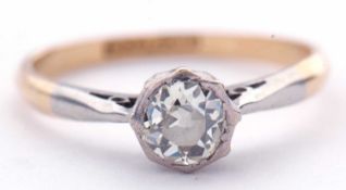 Antique diamond single stone ring featuring a old cut diamond in a rub-over setting, raised