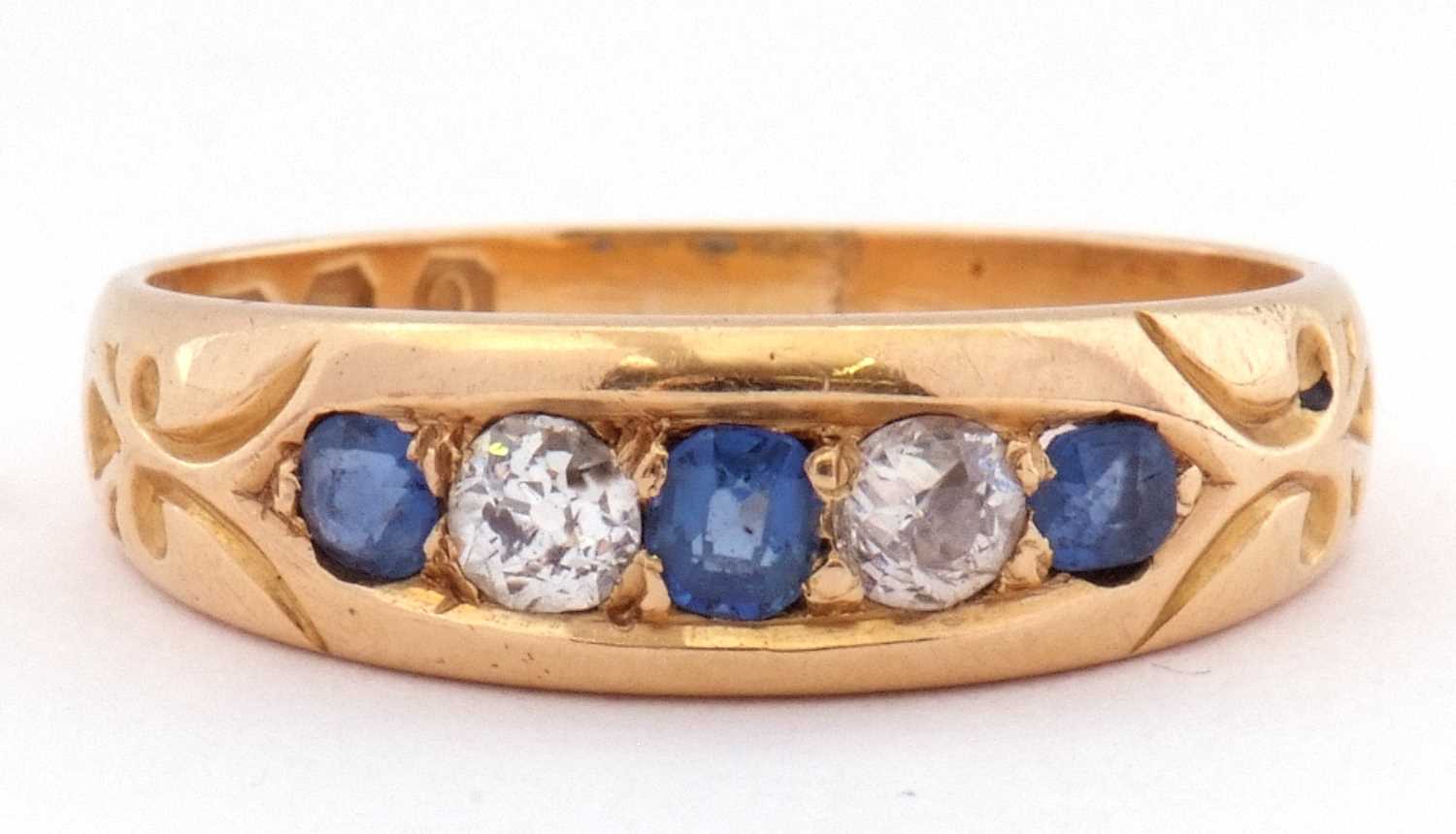 18ct gold sapphire and diamond ring, alternate set with three graduated sapphires and two round