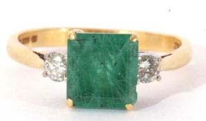 18ct gold emerald and diamond ring, the square cut emerald 7.64mm, between two small round brilliant