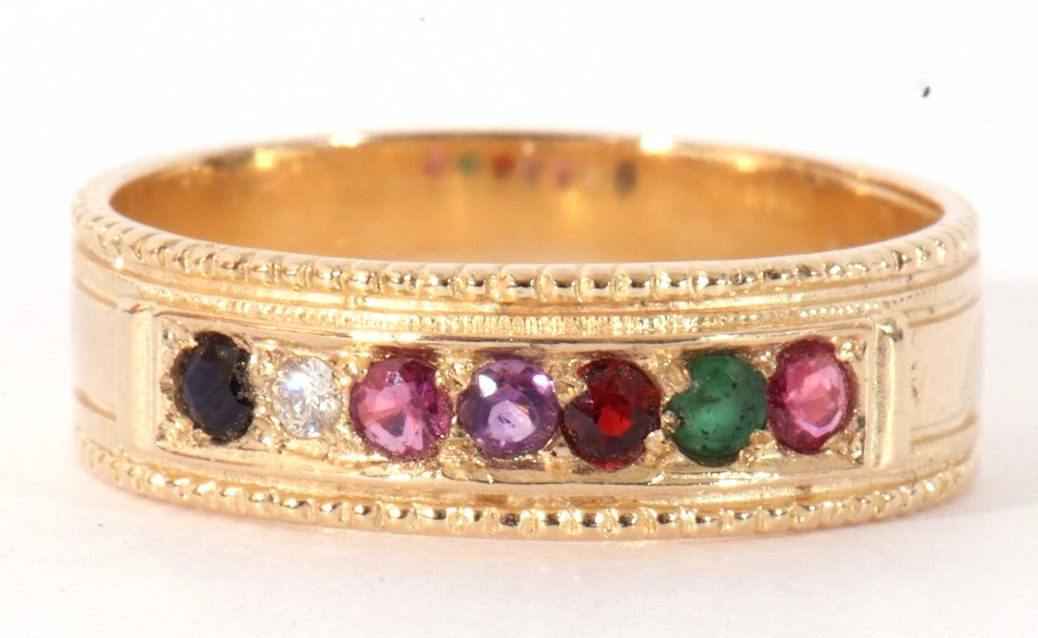 Modern 9ct gold multi-gem set ring featuring seven small gems between a beaded and plain shank, size