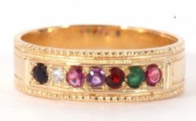 Modern 9ct gold multi-gem set ring featuring seven small gems between a beaded and plain shank, size