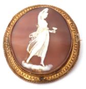 19th century Etruscan style unmarked gold framed shell cameo brooch of a classical lady holding a