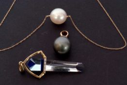 Mixed Lot: a faceted glass pendant in a 9ct gold and diamond set mount, 5cm long overall, a Tahitian