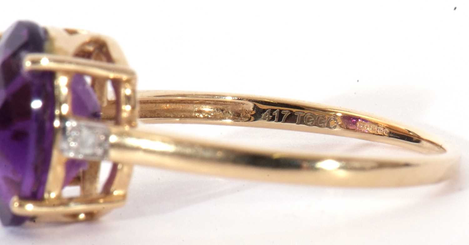 Modern 9ct gold amethyst and diamond ring, the oval faceted amethyst basket set and raised between - Image 8 of 9