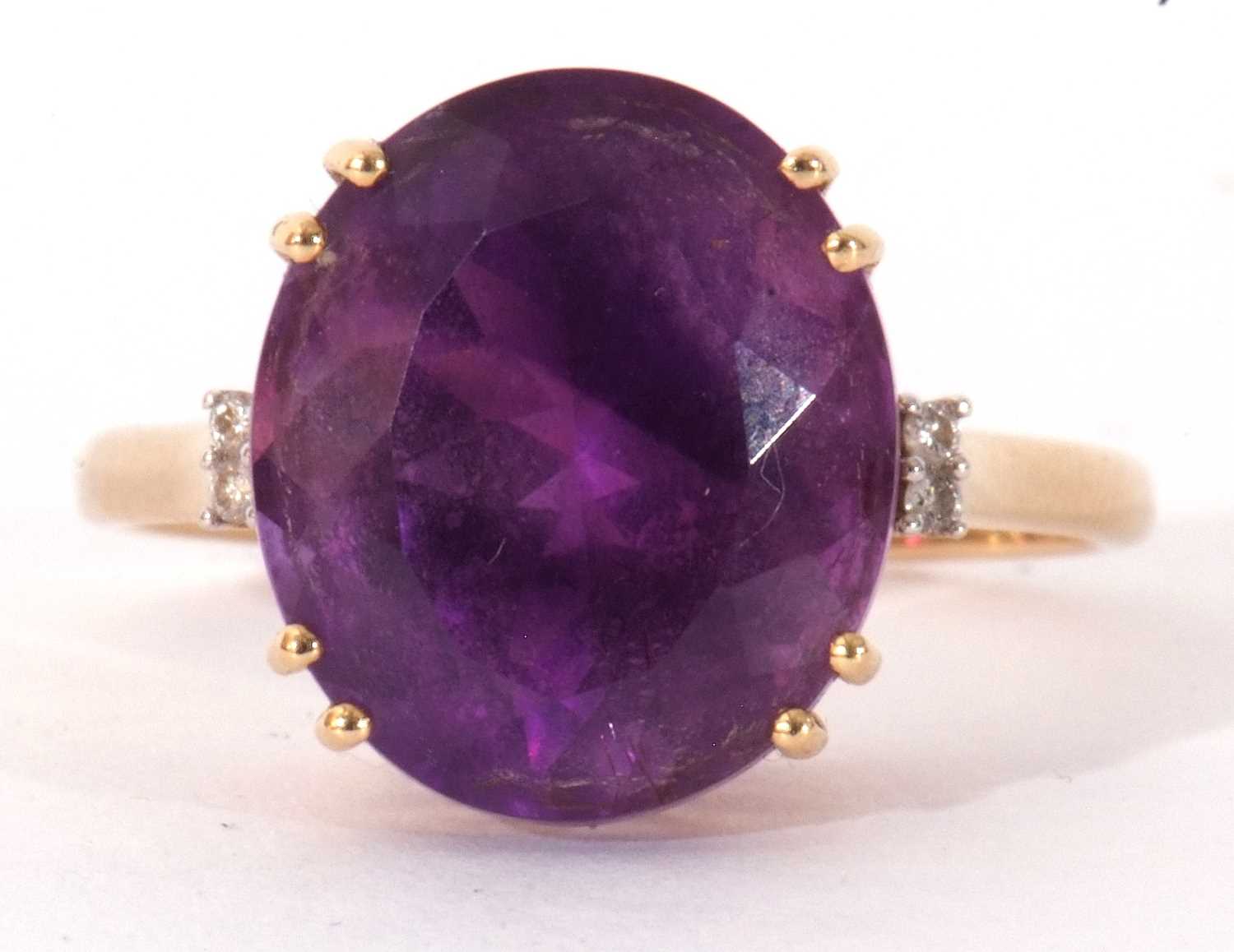 Modern 18ct gold, amethyst and diamond ring, the oval faceted amethyst four claw set and raised in a - Image 2 of 10