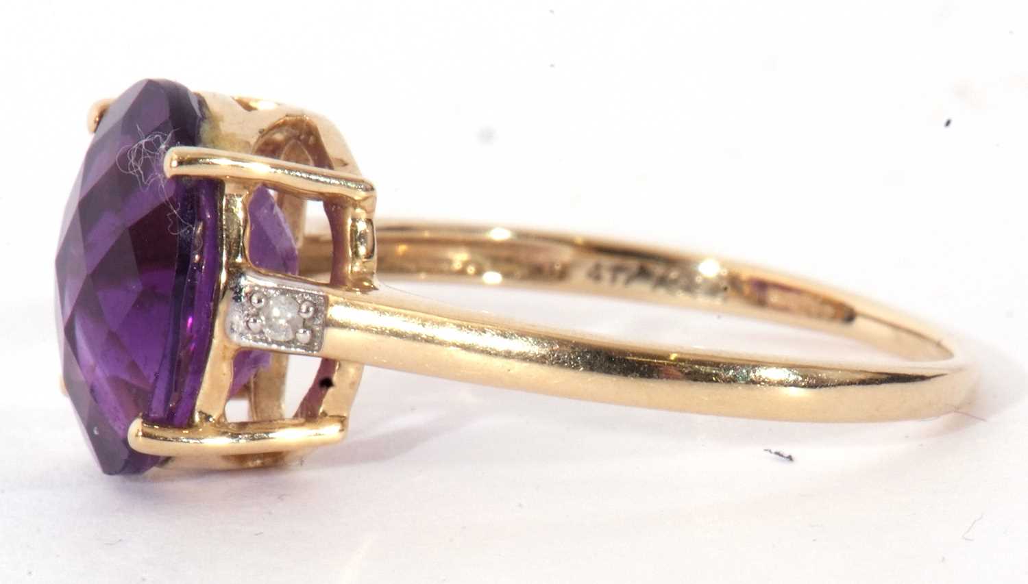 Modern 9ct gold amethyst and diamond ring, the oval faceted amethyst basket set and raised between - Image 4 of 9