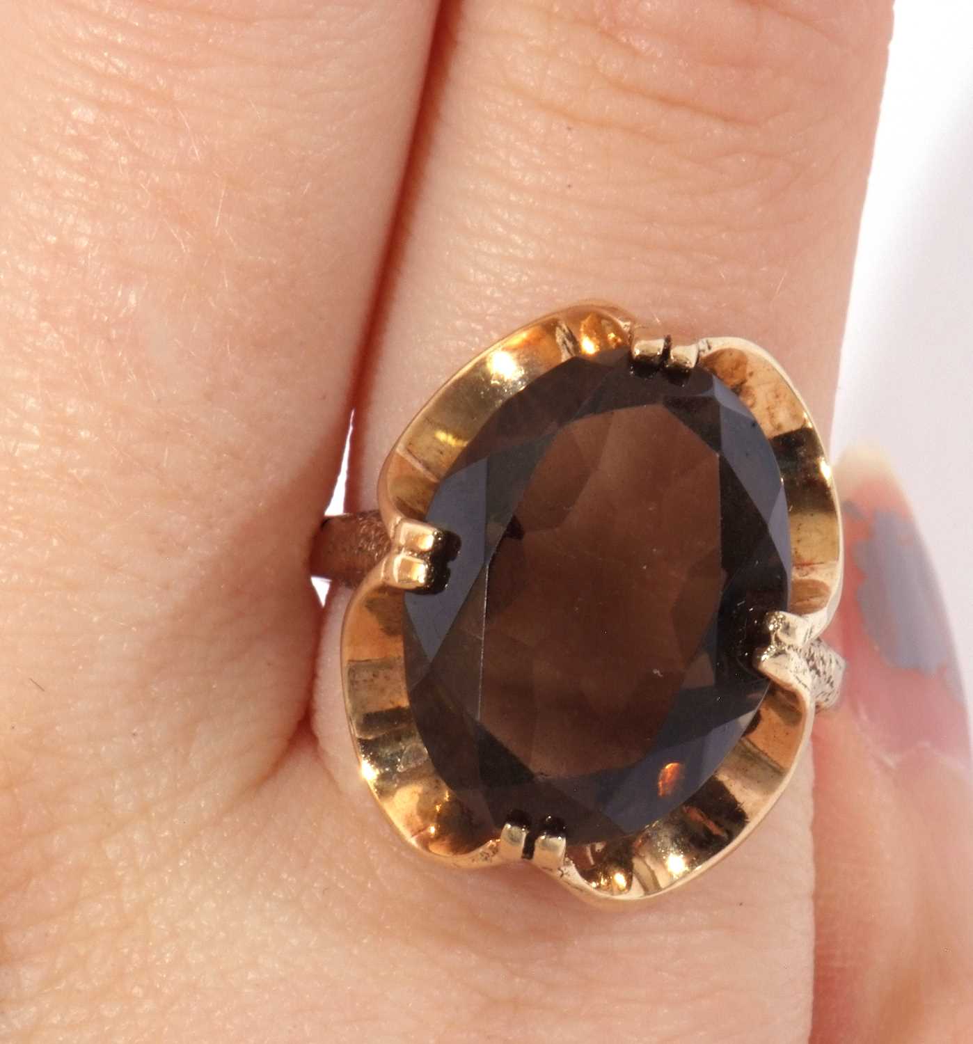 9ct gold smoky quartz dress ring, the large oval faceted quartz cardinal set in a stylised mount, - Image 9 of 9