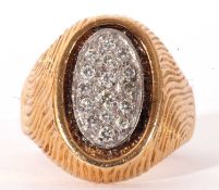 Large 18ct gold and diamond cluster ring, the oval panel (15 x 10mm) set with 16 small round