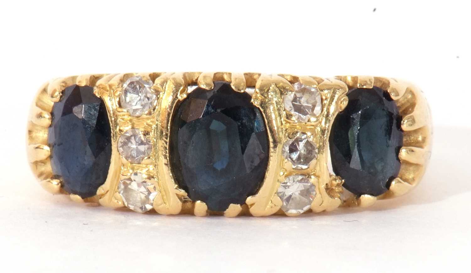 Sapphire and diamond ring featuring three graduated oval faceted sapphires highlighted between - Image 2 of 8