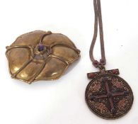 Mixed Lot: an unusual large metal lily pad buckle, together with a circular religious pendant