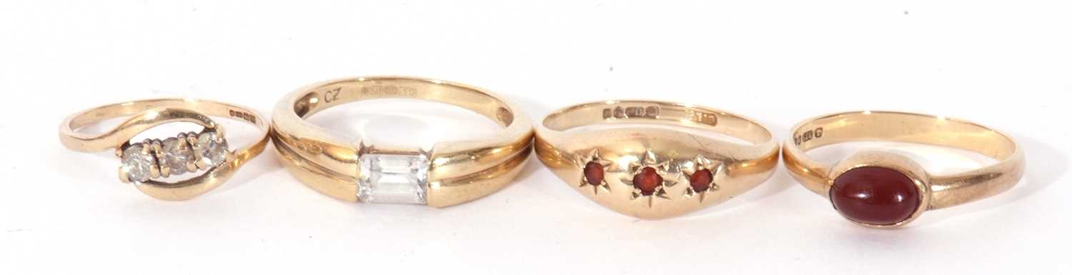 Mixed Lot: 9ct gold and cubic zirconia dress ring, a 9ct gold three stone garnet ring, a 9ct gold