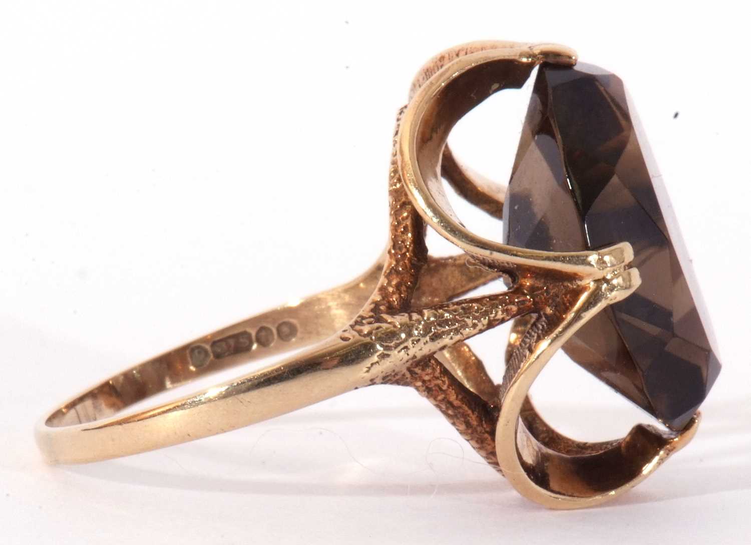 9ct gold smoky quartz dress ring, the large oval faceted quartz cardinal set in a stylised mount, - Image 7 of 9