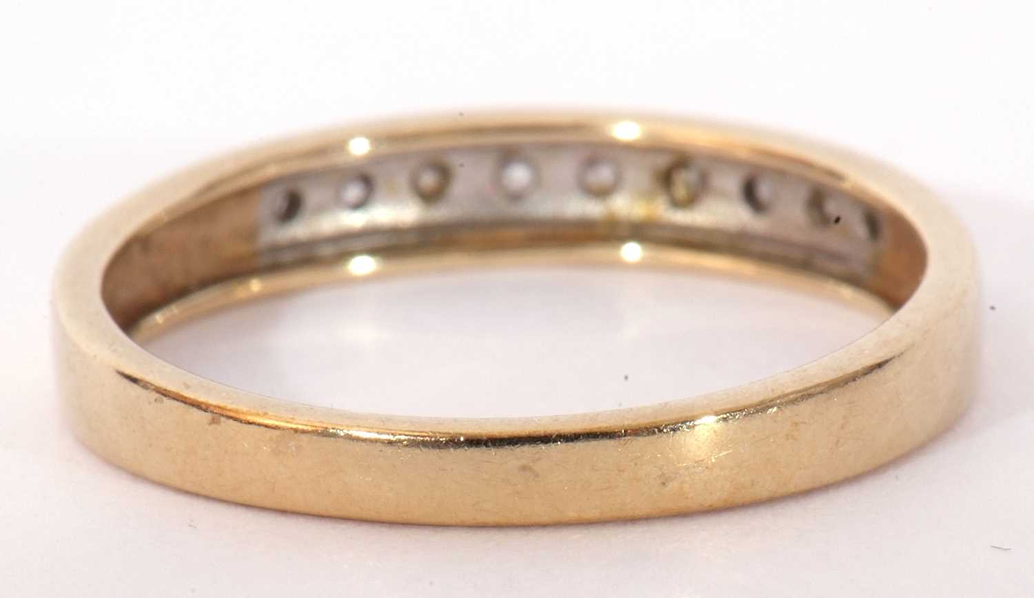 Modern 9ct gold and diamond half hoop ring, the top section set with nine small graduated single cut - Image 5 of 8