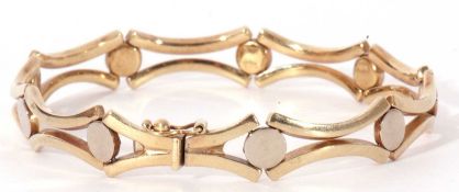 Modern 9ct gold bracelet, a stylised 'X' bar and disc link design, 18.5cm long, 12gms