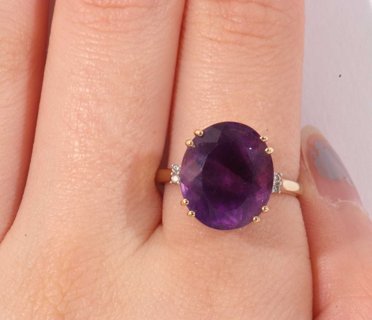 Modern 18ct gold, amethyst and diamond ring, the oval faceted amethyst four claw set and raised in a - Image 10 of 10