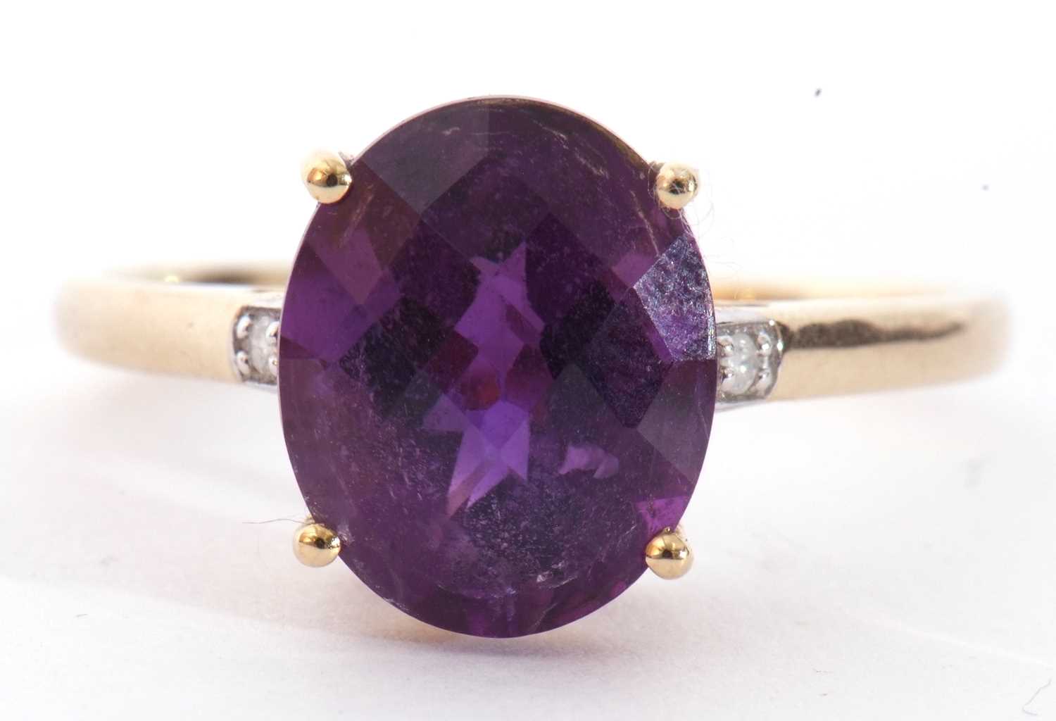 Modern 9ct gold amethyst and diamond ring, the oval faceted amethyst basket set and raised between - Image 3 of 9