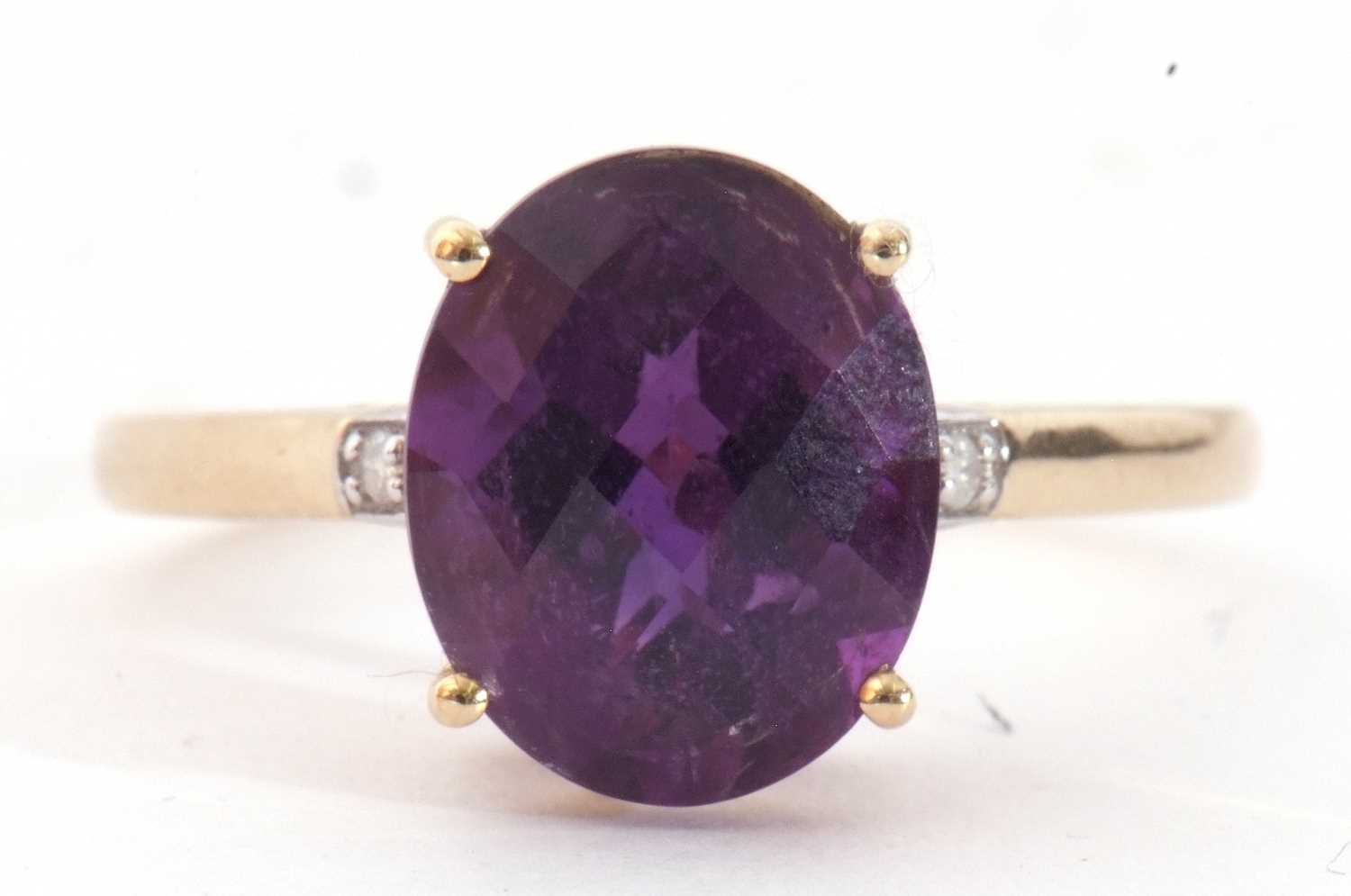 Modern 9ct gold amethyst and diamond ring, the oval faceted amethyst basket set and raised between - Image 2 of 9