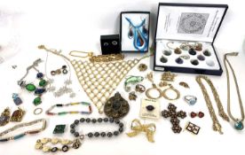 Box of costume jewellery to include brooches, necklaces etc