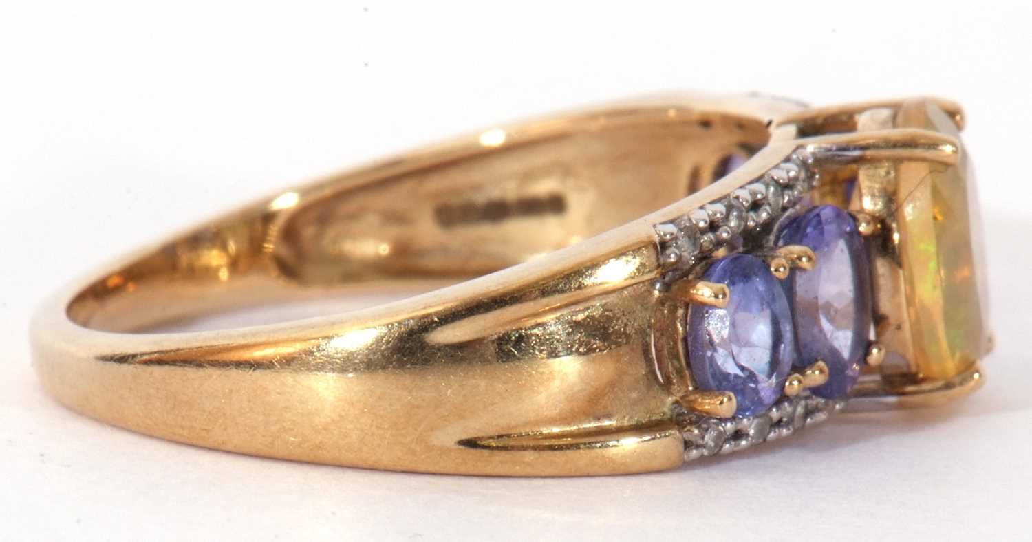 Modern 9ct gold, opal, tanzanite and diamond ring, the oval cut opal raised above a tanzanite and - Image 6 of 8