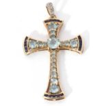 Modern 9k stamped cross pendant featuring 18 graduated light blue stones highlighted at each end