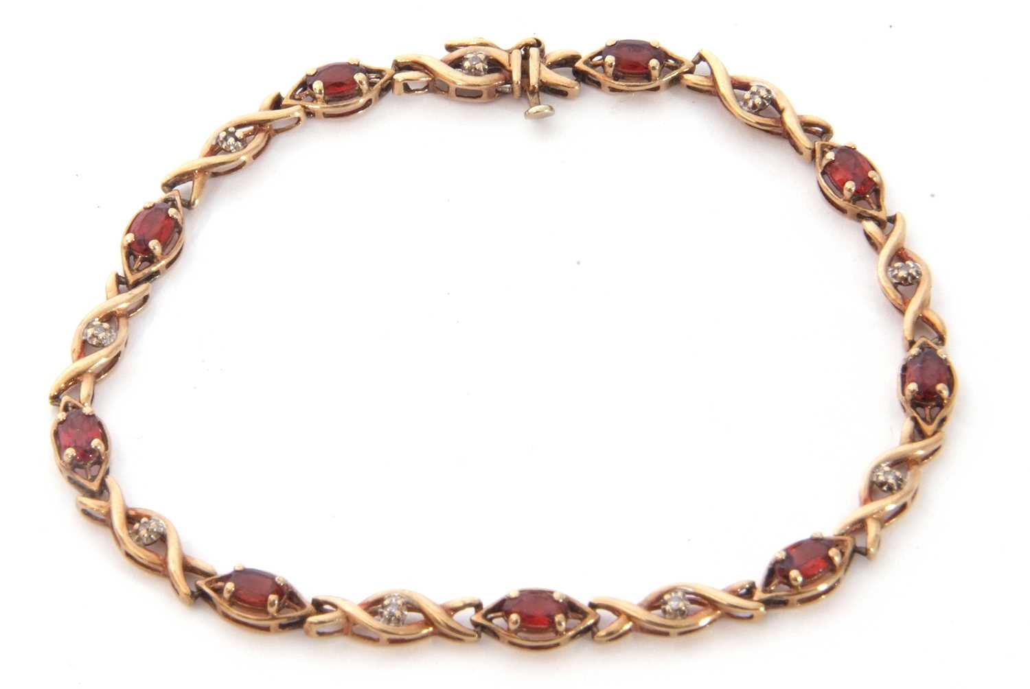 Modern 9ct gold and garnet small diamond line bracelet, alternate set with nine small oval cut - Image 2 of 6