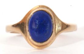 Modern 9ct gold and lapis lazuli set ring, the oval shaped lapis bezel set in a plain polished