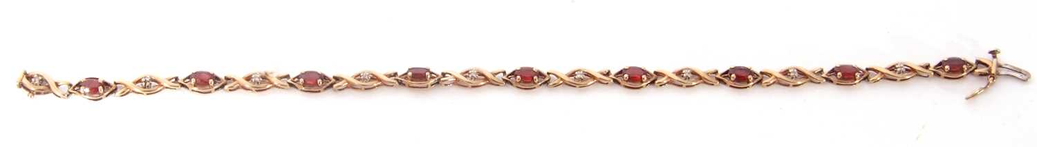 Modern 9ct gold and garnet small diamond line bracelet, alternate set with nine small oval cut - Image 4 of 6