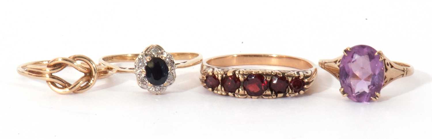 Mixed Lot: yellow metal and five stone graduated garnet ring, a 9ct gold purple stone ring, a 9ct