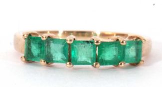 Modern 9ct gold and emerald ring set with five square cut emeralds, individually claw set, size I/J
