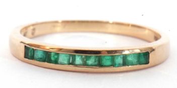 Modern 9ct gold and emerald ring featuring 10 calibre cut square emeralds, channel set, size R