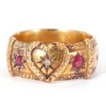 Antique 18ct gold ruby and diamond heart buckle ring centring a small old cut diamond set within