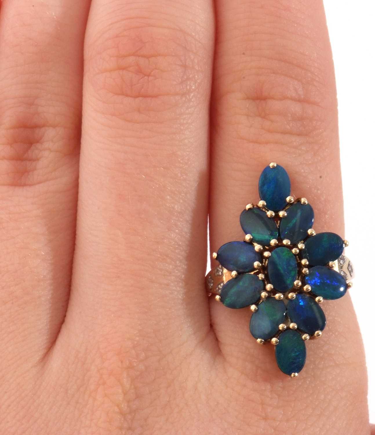 Modern 9ct gold black opal doublet dress ring, a lozenge design set with 11 opals, raised between - Image 9 of 10